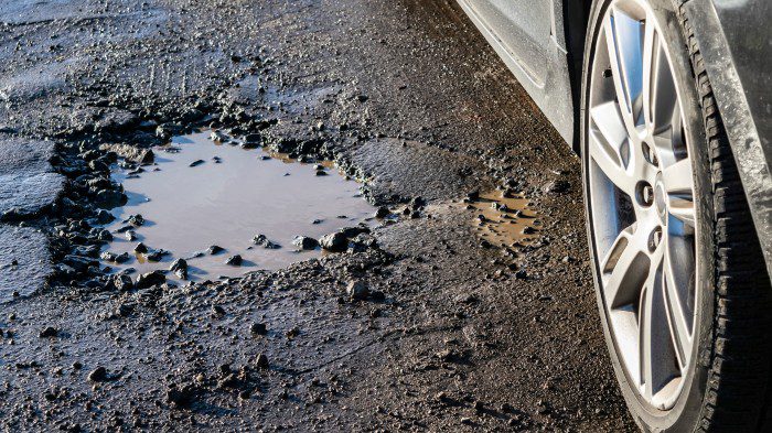 Car Has Pothole Damage